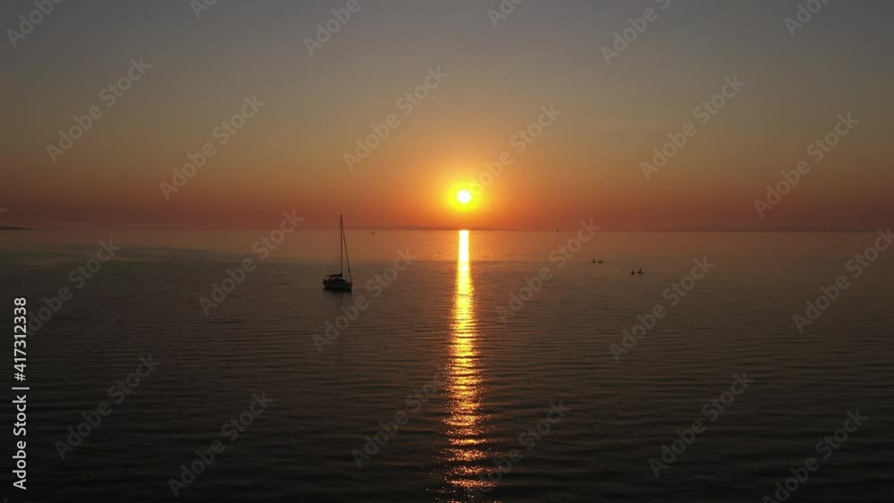 Aerial Shot of Beautiful Ocean Waters and Sunset Reflect on the Waters Aerial Shot of Beautiful Ocean Waters and Sunset Reflect on the Waters