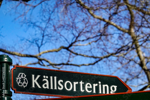 Photography Stockholm, Sweden  A sign in Swedish pointing towards a recycling station