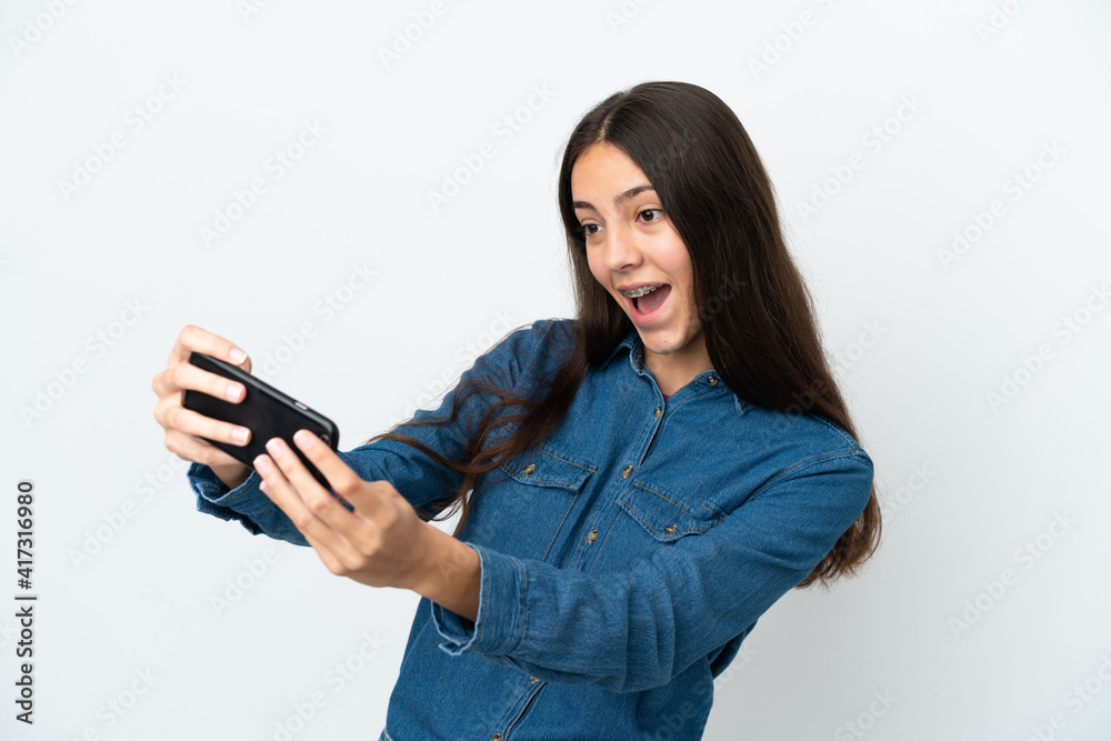 Young French girl isolated on white background playing with the mobile phone Young French girl isolated on white background playing with the mobile phone