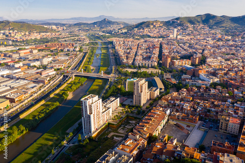 Aerial urban landscape of Santa Coloma de Gramenet municipality and Besos river, Catalonia, Spain photo