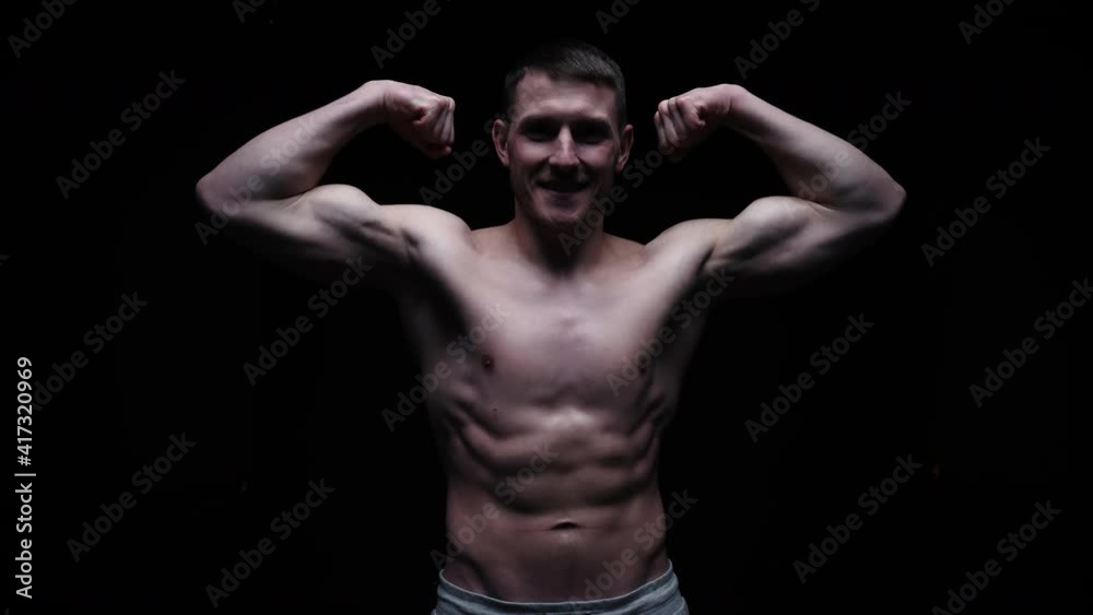Man Topless Showing Biceps Hands Up. Sportsman Showing Muscles. ABS, Biceps Muscles Man Topless Showing Biceps Hands Up. Sportsman Showing Muscles. ABS, Biceps Muscles