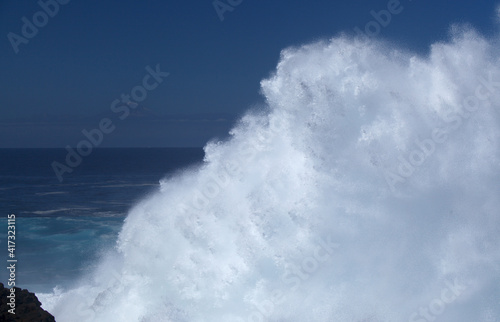 Gran Canaria  north coast  area around Punta Sardina cape  powerful foamy ocean waves breaking along the shore 