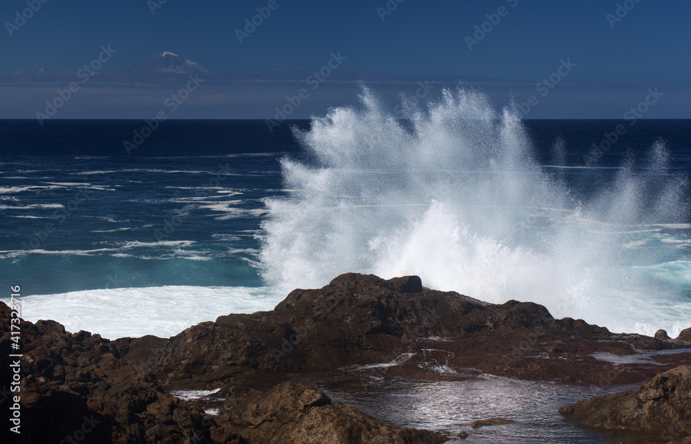 Gran Canaria, north coast, area around Punta Sardina cape, powerful foamy ocean waves breaking along the shore
