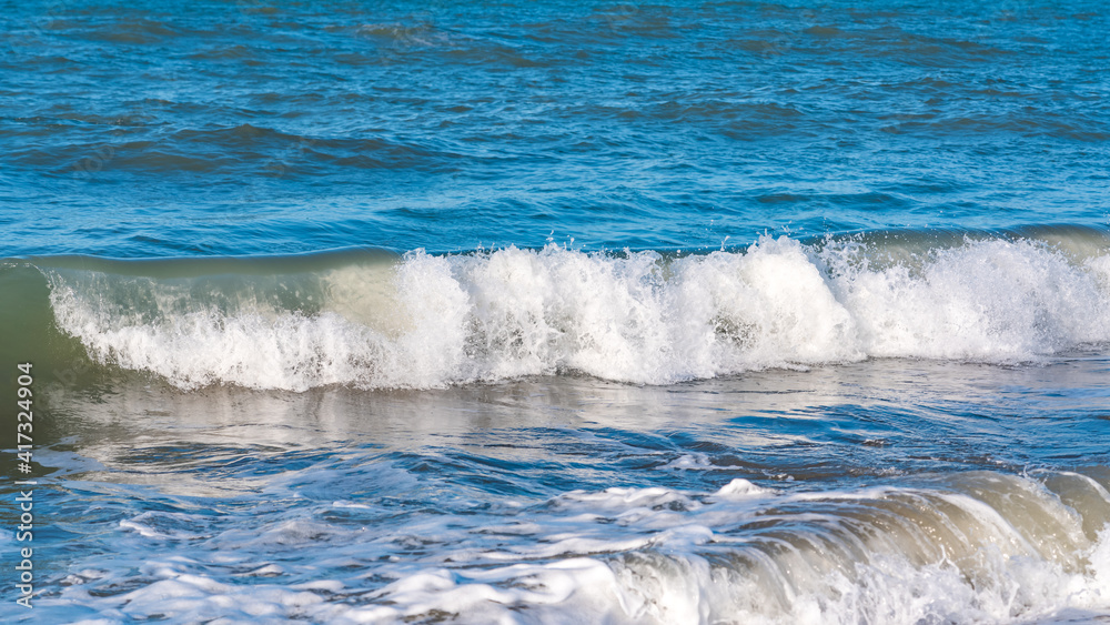 Obraz premium Beach with blue waves, summer relax