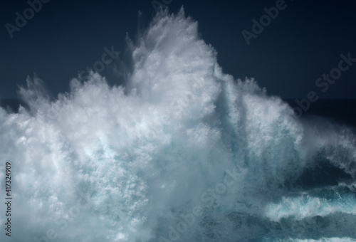 Gran Canaria, north coast, area around Punta Sardina cape, powerful foamy ocean waves breaking along the shore