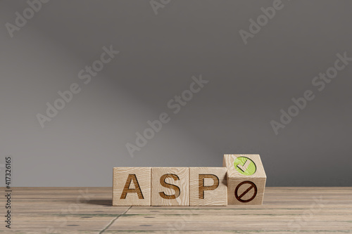 Fotografie Wood cubes with acronym 'ASP' on a beautiful wooden table, studio background