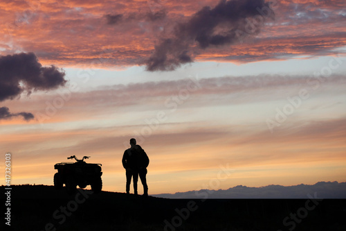 Silhouette ATV or Quad bike in the sunset. Holiday exploration concept © semisatch