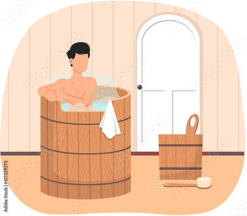 Man standing in wooden tub. Bathhouse at home interior design. Guy in barrel is resting in sauna. Male character is relaxing in hot steam. Person is bathing with hot or cold water and body brush