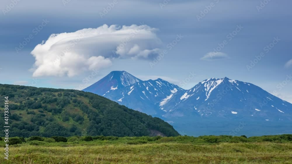 Dramatic spectacular lenticular cloud formation over volcano on Kamchatka peninsula, Russia, timelapse 4k Dramatic spectacular lenticular cloud formation over volcano on Kamchatka peninsula, Russia, timelapse 4k