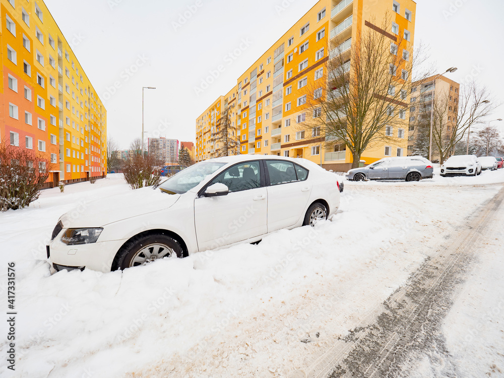 Parced car covered in snow in winter. Cars under big snow cover Parced car covered in snow in winter. Cars under big snow cover