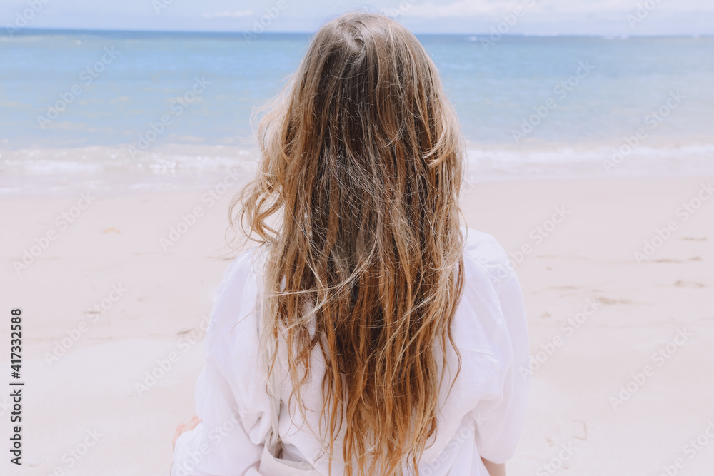 young beautiful woman doing meditation on beach young beautiful woman doing meditation on beach