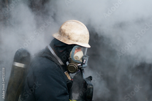 Firefighter with breathing equipment