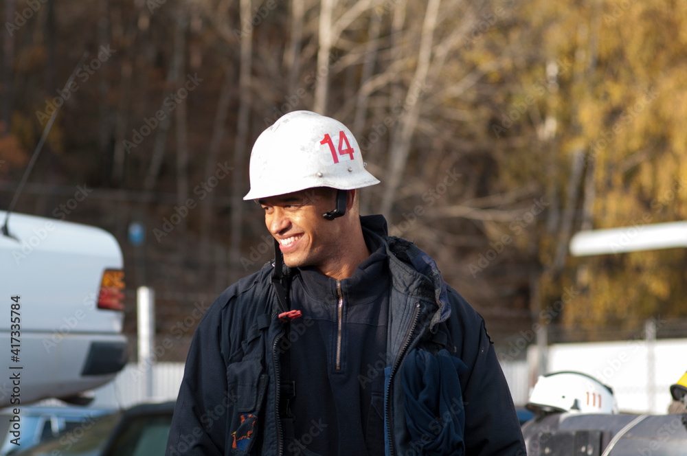 Smiling firefighter looking away Smiling firefighter looking away