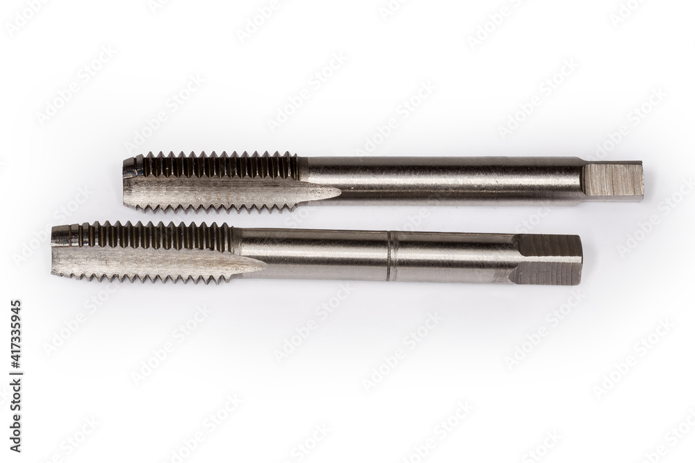 First and second taps for cutting thread on white background First and second taps for cutting thread on white background
