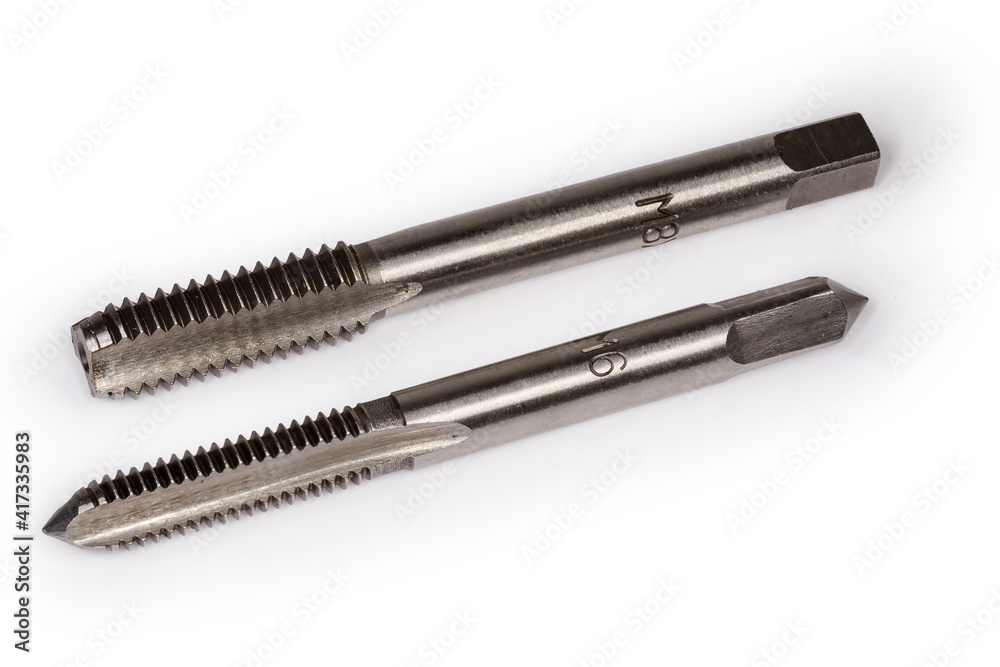 Taps with different metric thread size designation close-up Taps with different metric thread size designation close-up