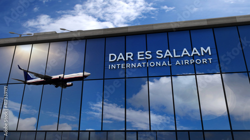 Airplane landing at Dar es Salaam Tanzania airport mirrored in terminal photo