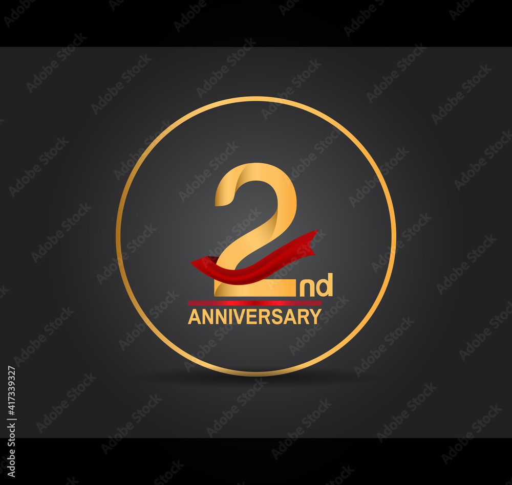 2 anniversary design golden color with ring and red ribbon isolated on black background for celebration moment