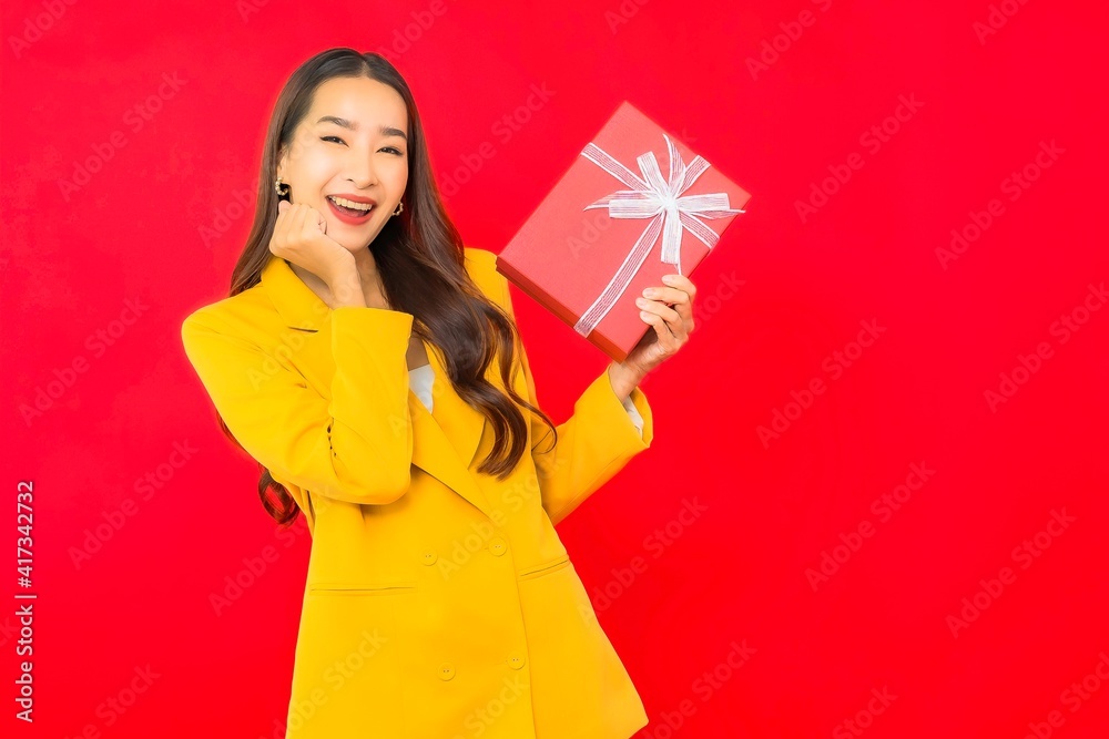Portrait beautiful young business asian woman with red gift box Portrait beautiful young business asian woman with red gift box
