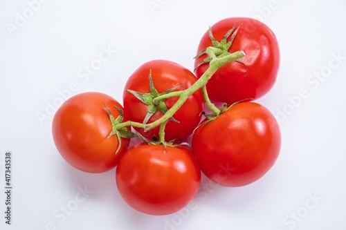 Tomato isolated food ripe red. Close-up of a tomato on a white background. © Colored emotions