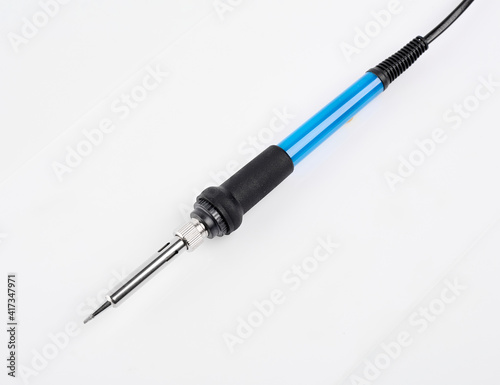 Soldering iron isolated on a white background. A tool for soldering wires, installing pipes, tinning or burning out. 