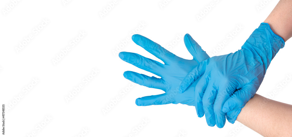 Doctor putting on protective gloves, isolated on white Doctor putting on protective gloves, isolated on white