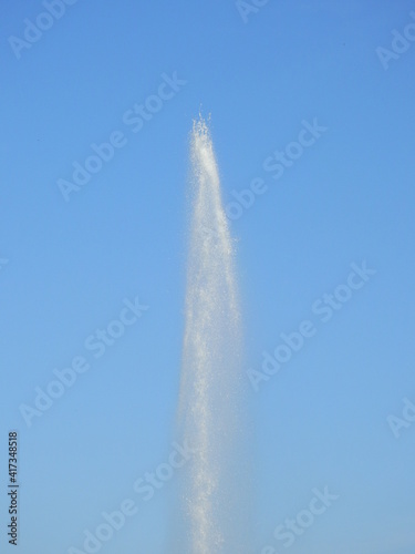 splash water of fountain with blue sky background
