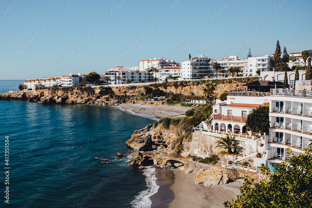 View of rocky coast and city located in mountains, on cliff. Authentic landscape. Travel in Europe, tourism.