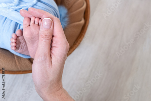 Newborn baby feet. Motherhood concept. Mother day. Copy space. Newborn baby feet. Motherhood concept. Mother day. Copy space.