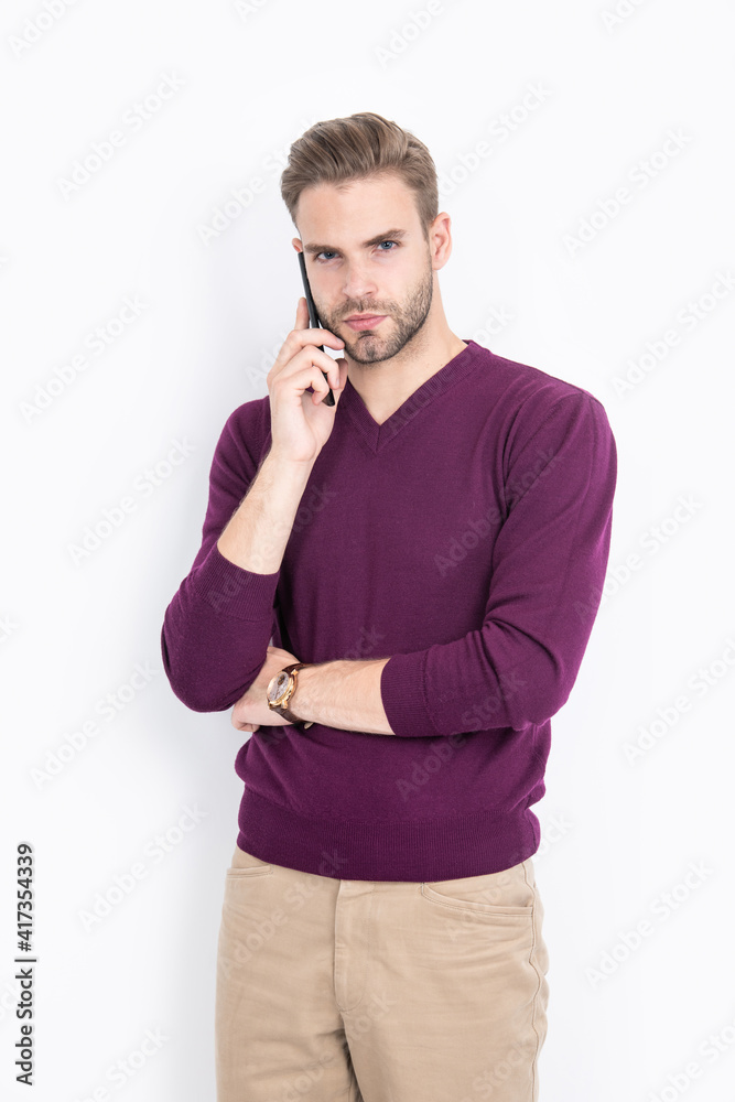 Modern guy in casual fashion style talk on mobile phone isolated on white, communication Modern guy in casual fashion style talk on mobile phone isolated on white, communication