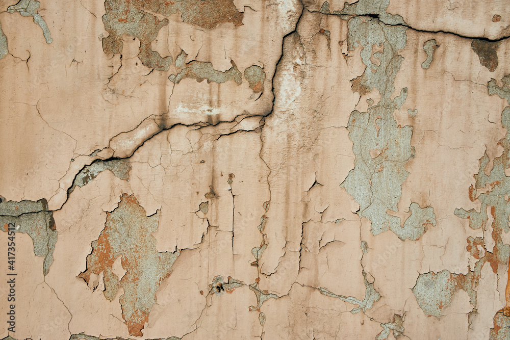 Obraz premium acked flaking white paint. Cracked weathered concrete wall wide texture. Background for wallpaper.