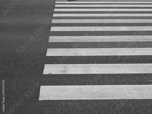 white line of crosswalk on the asphalt road