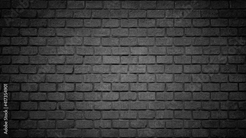 Black brick wall texture or brick surface for background. Vintage wallpaper.