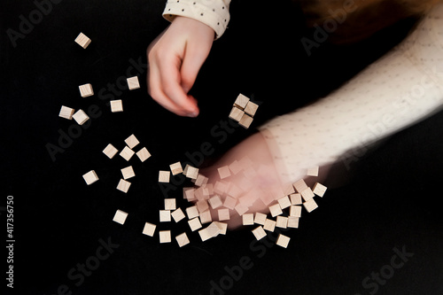 Child plays with wooden blocks.
Stack game with wooden cubes.
Kind spielt mit Holz Bausteinen.
Stapel spiel mit Holzwürfeln. photo