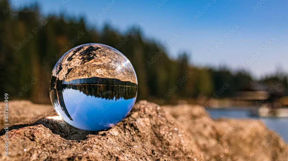 Crystal ball alpine summer landscape shot at the famous Grosser Arbersee, Bayerisch Eisenstein, Bavarian forest, Bavaria, Germany Crystal ball alpine summer landscape shot at the famous Grosser Arbersee, Bayerisch Eisenstein, Bavarian forest, Bavaria, Germany