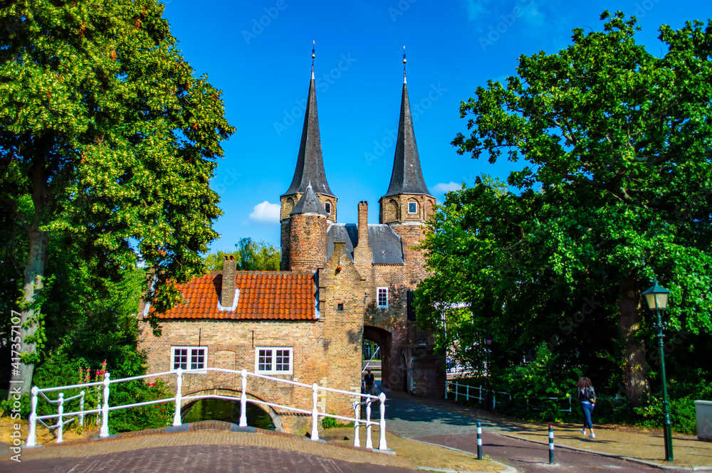 Delft, Netherlands - July 11, 2019: Oostpoort or the Eastern Gate, built in 15th century, the old gate of the town of Delft in the Netherlands