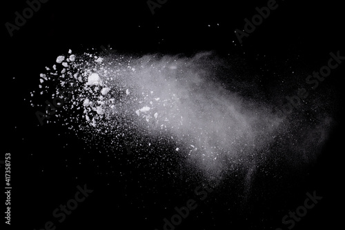 Abstract design of white powder cloud splash isolated on black background