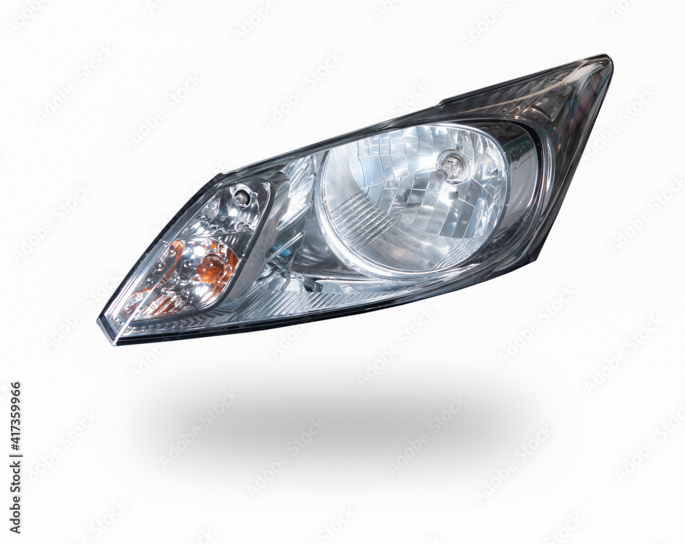 Closeup of car headlight isolated on white background