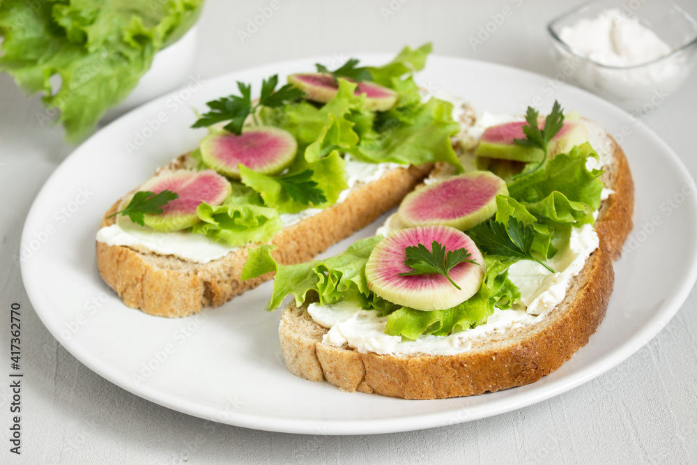 Tasty and delicious toast with lettuce, radish and cream cheese. Ketogenic diet. Healthy lifestyle.