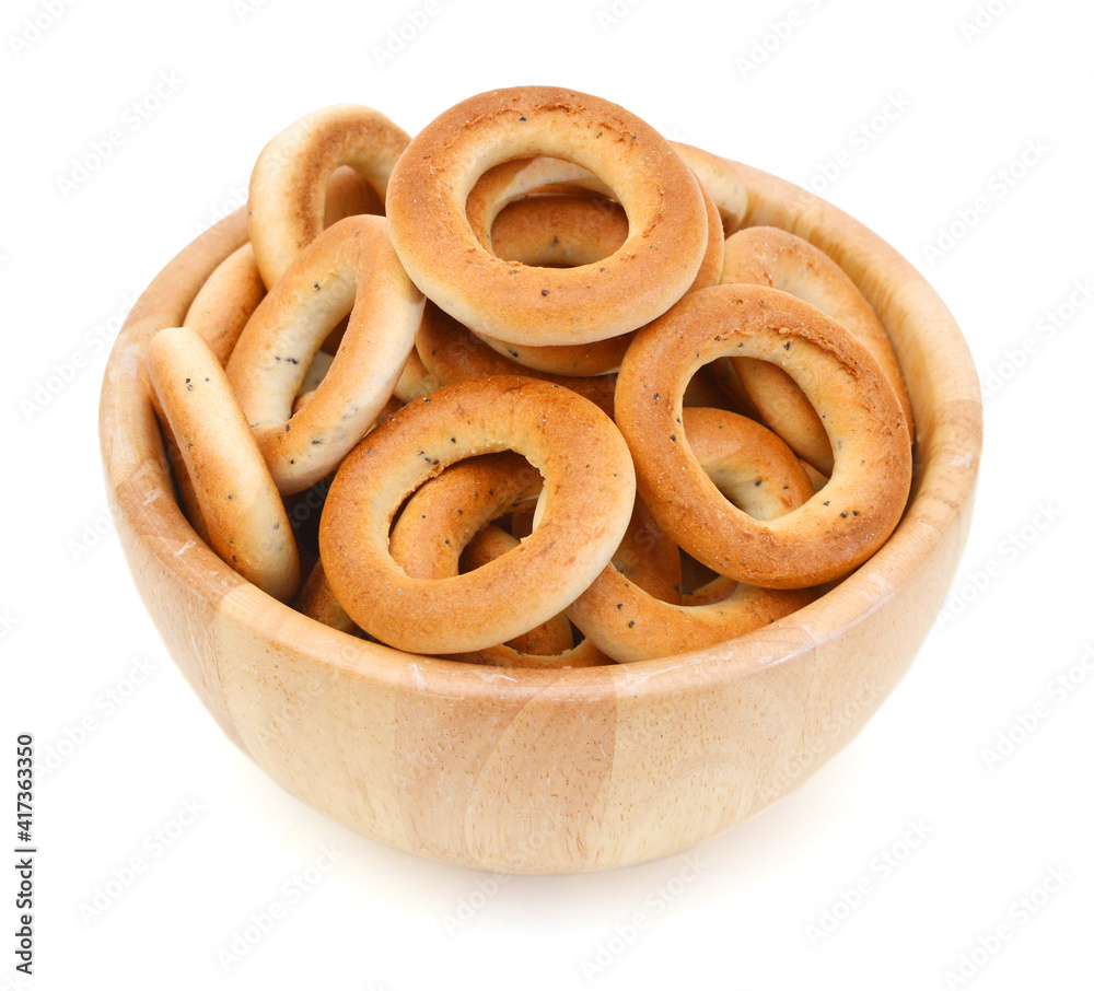 Bagels isolated in wooden bowl on a white background