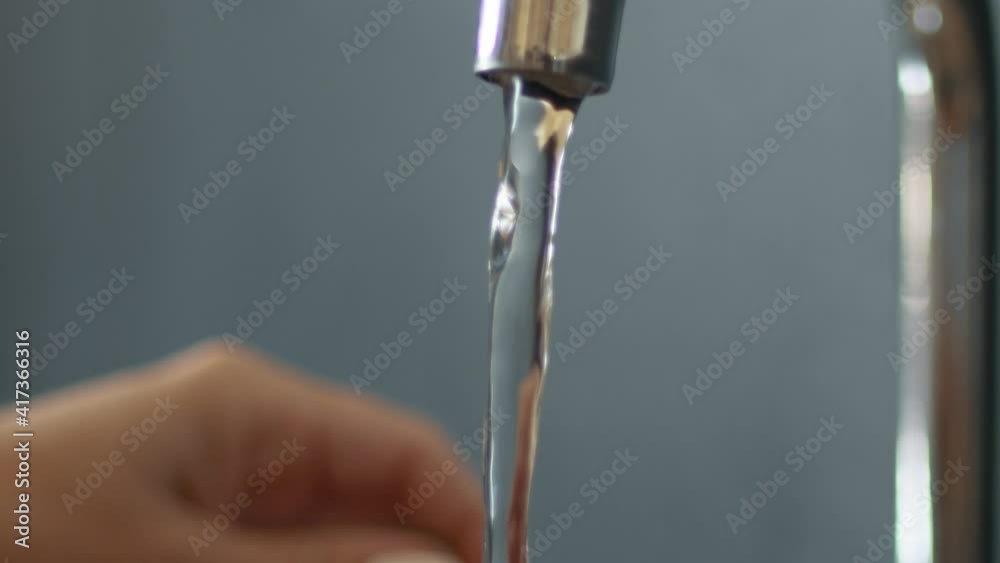Female hands washing a tomato under running water. 4K 120fps slowmotion Female hands washing a tomato under running water. 4K 120fps slowmotion