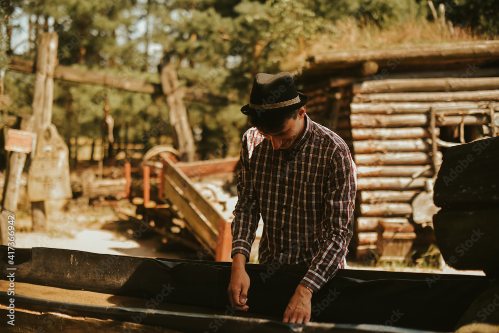 The man found gold. Contemporary lucky prospector found lot of gold in creek when panning sand.