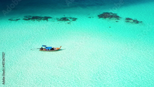 aerial view long tail boats and Beautiful crystal clear water at island Koh Lipe in Satun,Southern Thailand,Summer and travel vacation concept.