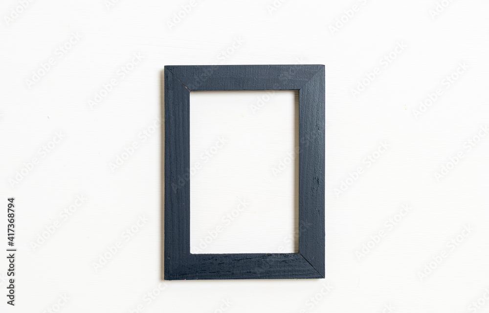 empty picture frame on white wall background empty picture frame on white wall background