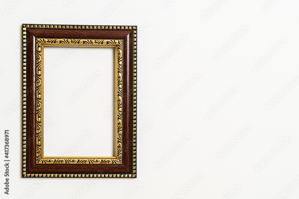 empty picture frame on white wall background empty picture frame on white wall background