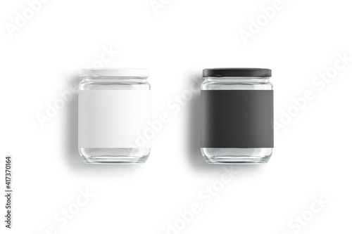 Blank glass jar with black and white label mockup lying photo