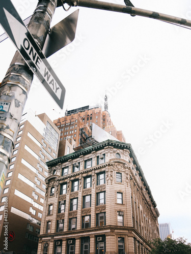 Low angle shot of a street sign with high-rise buildings in the background in New York, USA