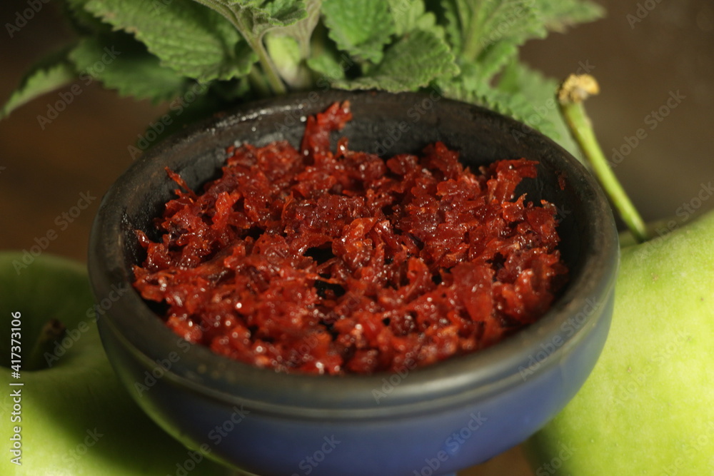 bowl with hookah tobacco. berries on a black background. nargile smoking bowl with hookah tobacco. berries on a black background. nargile smoking