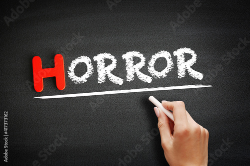 Horror text on blackboard, concept background photo