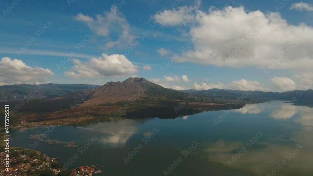 Aerial view Mountains, volcanoes, crater lake Batur, Bali, Indonesia. Mountain landscape with volcanoes, lake, sky and clouds. 4K video. Travel concept Aerial footage Aerial view Mountains, volcanoes, crater lake Batur, Bali, Indonesia. Mountain landscape with volcanoes, lake, sky and clouds. 4K video. Travel concept Aerial footage