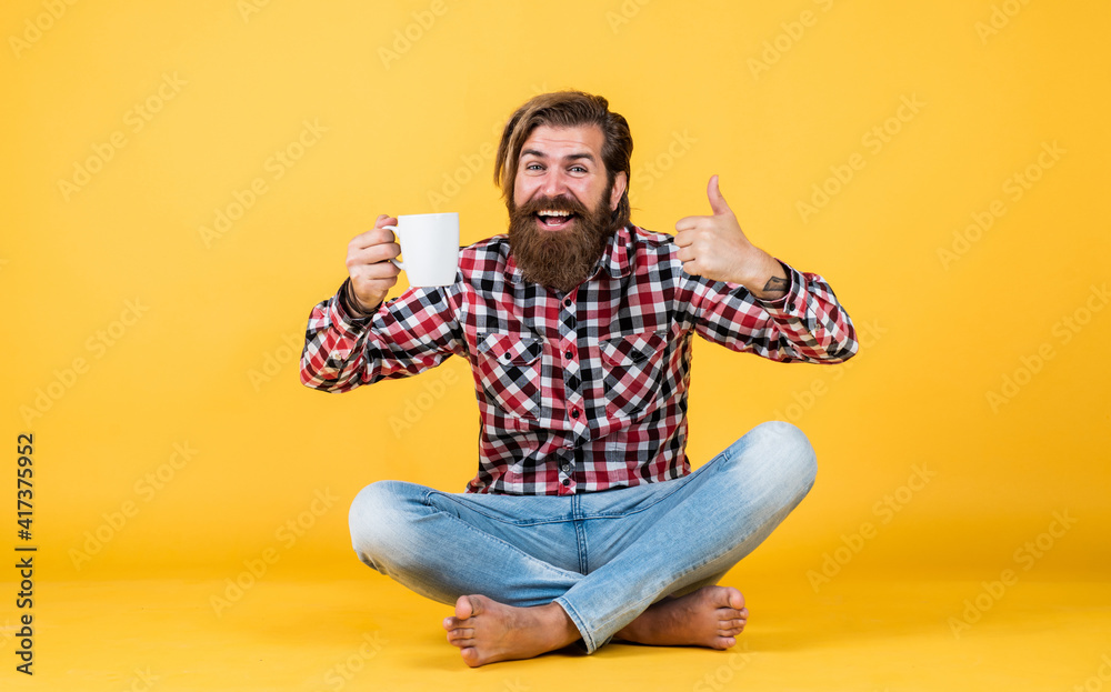 try this. man drink hot tea from cup. good morning. energetic warm beverage. coffee for inspiration. perfect start of the day. happy bearded man drinking morning coffee. thumb up for best taste try this. man drink hot tea from cup. good morning. energetic warm beverage. coffee for inspiration. perfect start of the day. happy bearded man drinking morning coffee. thumb up for best taste